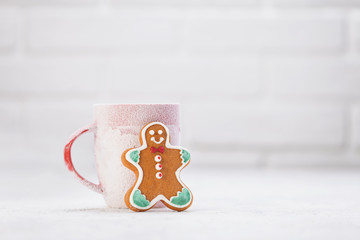 Snowy winter cup with gingerbread christmas cookies