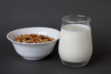 healthy Breakfast: a glass of milk and a Cup of muesli