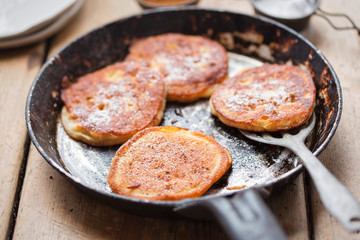 Pancakes with apples, cinnamon and icing sugar 