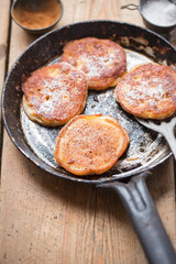 Pancakes with apples, cinnamon and icing sugar 