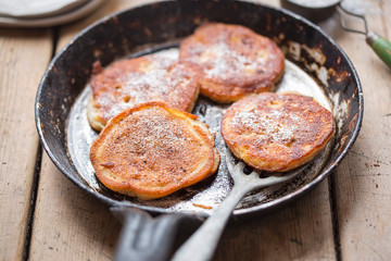 Pancakes with apples, cinnamon and icing sugar 