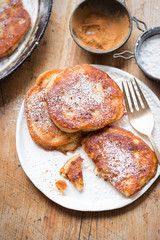 Pancakes with apples, cinnamon and icing sugar 