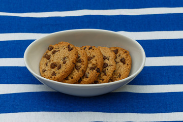 Homemade chocolate cookies in a porcelain plate. Closeup.