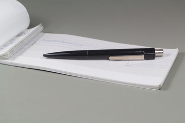French checkbook and black pen on a desk - 309266859