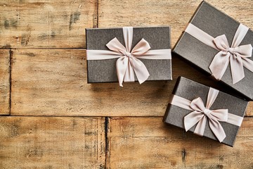 Top view photo of gift box on wooden table. Copy space.