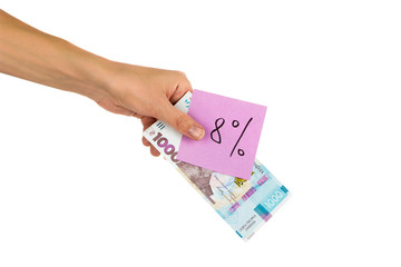 Thousand hryvnias and sticker with different financial signs and symbols in the hand