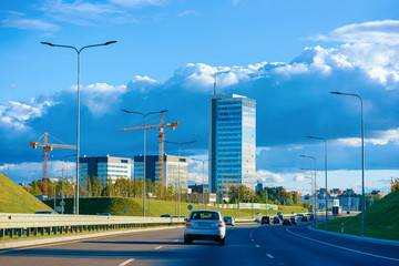 Car on road and Corporate business offices in street