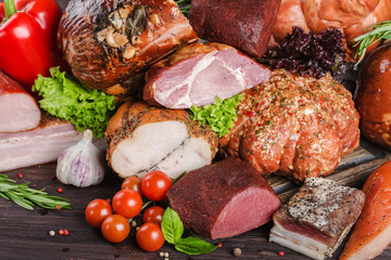 Assorted meat products, including ham, sausage, balyk, lard, basturma.