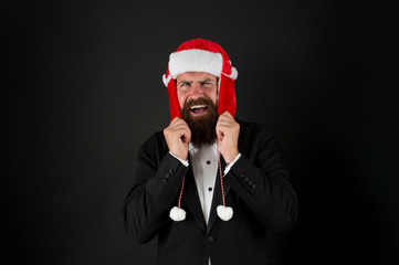 Businessman Santa in jacket. Christmas party concept. Feeling warmth. Funny winter hat. Business...