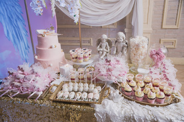 candy bar decoration for the baptism of the child, sweets and handmade pastries