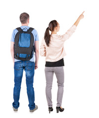 Obraz premium Back view of a stylish couple pointing.