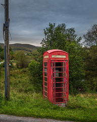 A K6 type Red phone box in remote rural location in Scotland