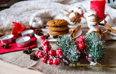 Holiday background with cookies and candles. Winter and Christmas mood