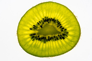 Fototapeta na wymiar A slice of ripe kiwi on a white background.