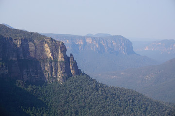 Mountain cliffs hanging over the forest