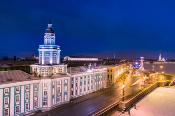 Obraz premium Saint Petersburg. Russia. Kunstkamera. Spit of Vasilyevsky Island. Rostral columns. Night Petersburg. Neva River. To the sights of St. Petersburg. Tourism in Russia. Russia europe. Cities of Russian
