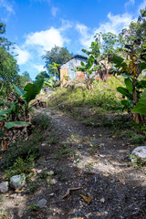 Fototapeta na wymiar dramatic image of small wooden Haitian homes in the mountains of the dominican republic.