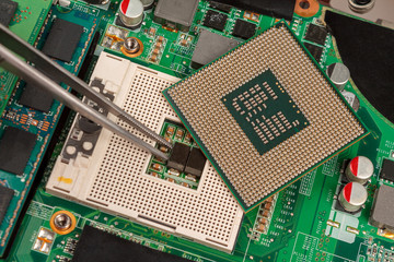 computer CPU close-up on the motherboard background, socket of central process unit, connection of ...