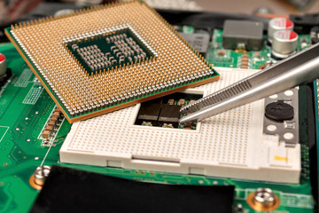 computer CPU close-up on the motherboard background, socket of central process unit, connection of ...