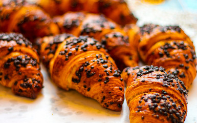 detail of a group of delicious freshly baked croissants with chocolate, ideal for background - 309275262