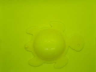  close-up of a turtle, a symbol of longevity, wisdom and protection on an abstract classic yellow background