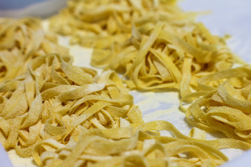handmade tagliatelle and ready to be cooked in a professional Italian kitchen