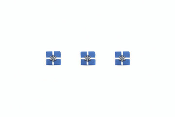 Flat Christmas composition with festive boxes of blue decorated with a white satin ribbon and a silver snowflake. Concept Christmas, minimalism, holiday, sale, color 2020.