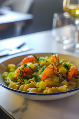 haute cuisine dish pasta risotto with potatoes, celery and red prawns. In a luxurious Italian restaurant