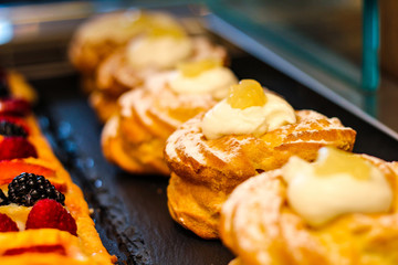 rows of fruit desserts and custard in typical Italian pastries