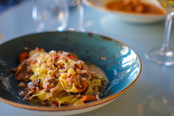 tagliolini with seafood in a refined Italian restaurant