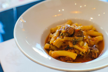 pasta alla genovese, a typical Neapolitan recipe with onions and meat in an Italian restaurant - 309279274