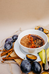 Healthy vegan oatmeal with goji and cocoa.