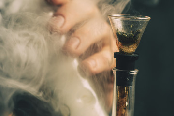 Smoke on a black background. Concepts of medical marijuana use and legalization of the cannabis....