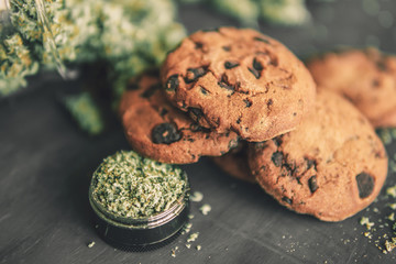Cookies with cannabis and buds Macro of cannabis buds marijuana with trichomes bud with trichomes...