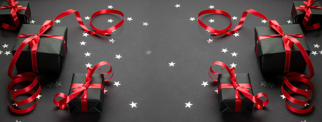 New years background. Christmas gifts with red ribbon on white b