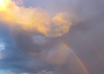 Fototapeta premium Mysterious cloud and rainbow in the sky, soft focus.