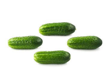 Green isolated cucumbers on a white background close-up