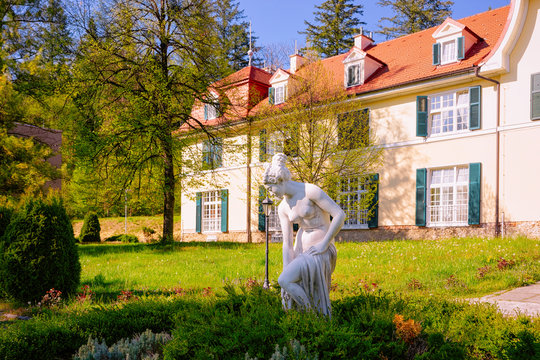 Woman statue in garden at Old villa in Rogaska Slatina in Slovenia in South Styria. Travel in Europe Slovenian luxury spa resort. Summer view. Town destination. Cityscape and landscape.