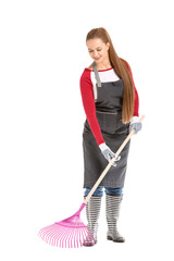 Woman with rake for autumn leaves clean-up on white background