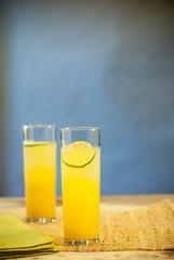 Yellow cocktails with lime 