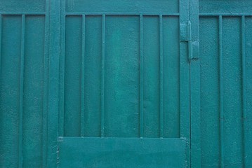 green iron texture from an old metal door with bars