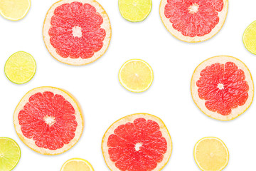 Fresh cut grapefruit, lemon and lime on white background