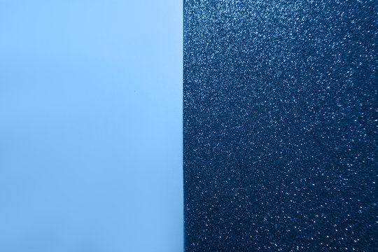 Color blue papers background with glitter. Trendy colour.