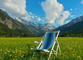 beach chair in alpine meadow with mountain view in the alpls, Allgäu Alps, Bavaria, Germany