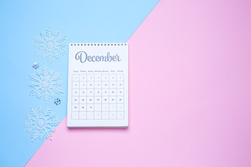 Calendar with page of December on color background