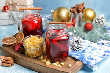 Mason jars of tasty mulled wine on table