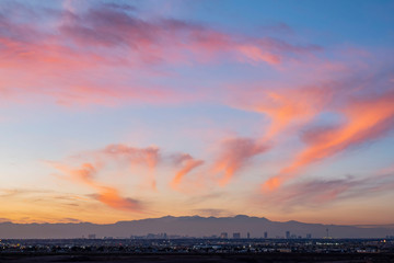 Sunset aerial view of the strip with mountain behind