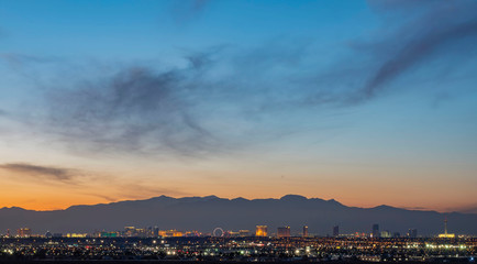 Fototapeta na wymiar Sunset aerial view of the strip with mountain behind