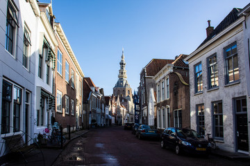 Fototapeta na wymiar Zierikzee, Netherlands - December 6, 2019 - View on old Dutch houses and tower of City Museum in Zierikzee, historical town in province Zeeland, Netherlands