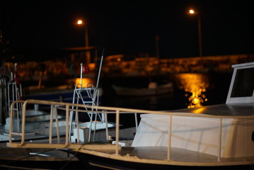 night views in the port city.small fishing boats in the harbor, the seashell reflecting on the sea